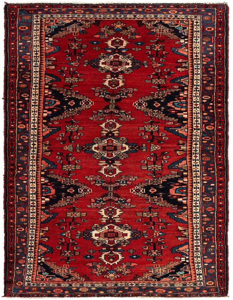 A 10 Ft Ardabil runner rug in rich red with intricate Persian tribal patterns in navy, cream, and orange, ideal for a hallway.