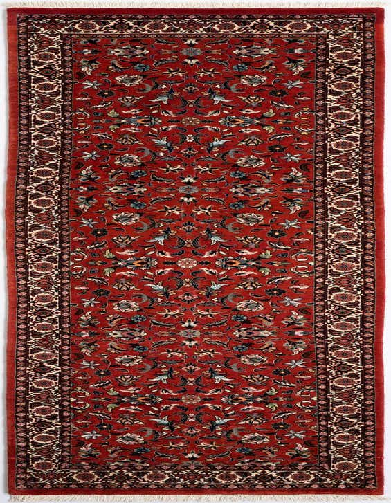 A 10 ft red Persian runner rug with intricate floral patterns in blue, green, and cream, ideal for a hallway.