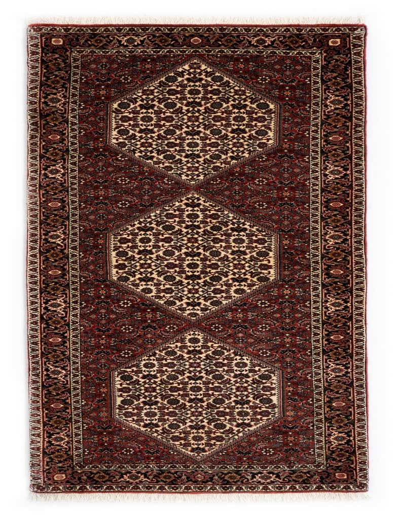 A 7 ft runner rug in a traditional Persian style, featuring a rich red field with intricate floral patterns and cream medallions, suitable for a hallway.