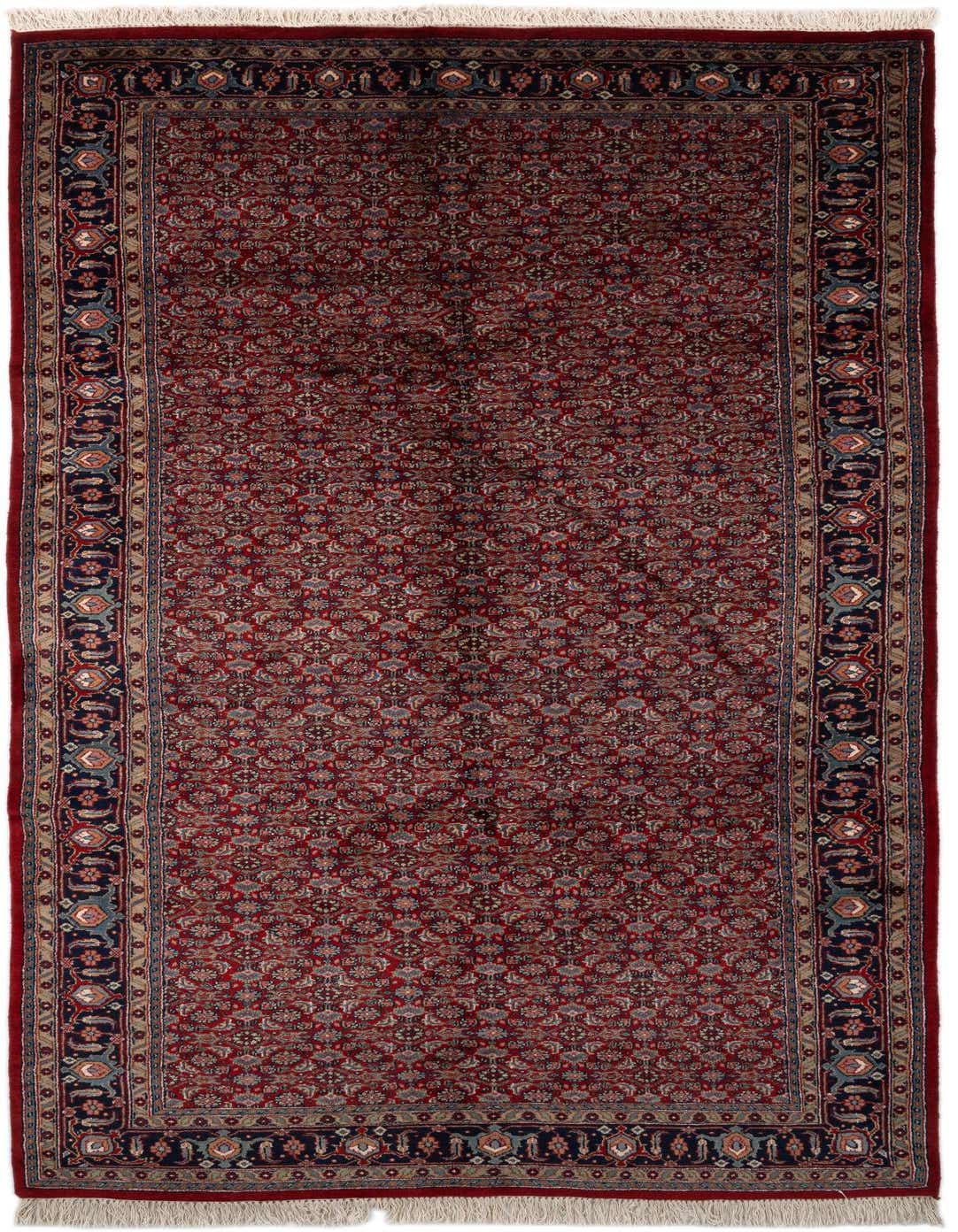 A 11 ft runner rug in traditional Oriental style, featuring a rich red field with intricate floral patterns and a dark blue border.