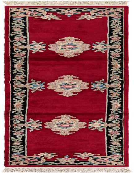 A 12 ft red wool runner rug with an intricate black border featuring light pink, blue, and green floral oriental patterns.