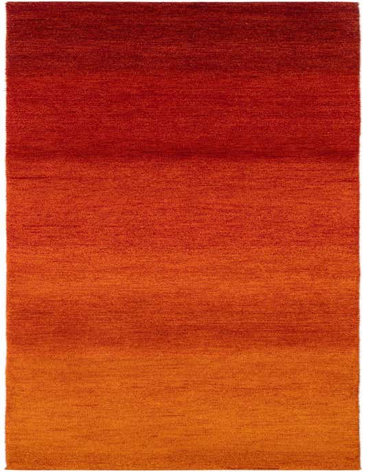 A 10 ft runner rug in a modern abstract style, featuring a vibrant gradient of deep red to warm orange, ideal for a hallway.