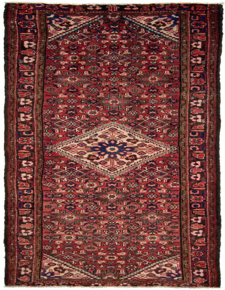 A 10 ft red Persian runner rug with a tribal pattern, featuring a central diamond medallion and intricate floral motifs, ideal for a hallway.