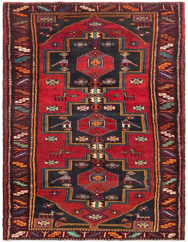 A 10 ft Hamedan runner rug featuring a tribal, traditional pattern in deep reds, navy, and earthy tones, ideal for a hallway.