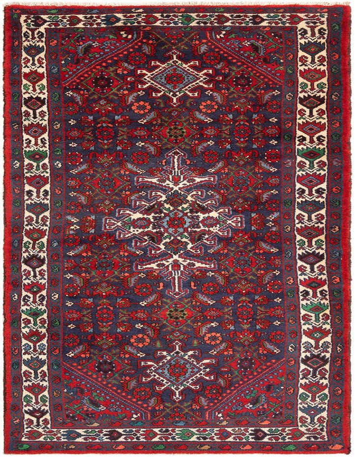 A 10 ft Hamedan runner rug in deep red and navy blue with intricate tribal and traditional patterns, ideal for hallways.