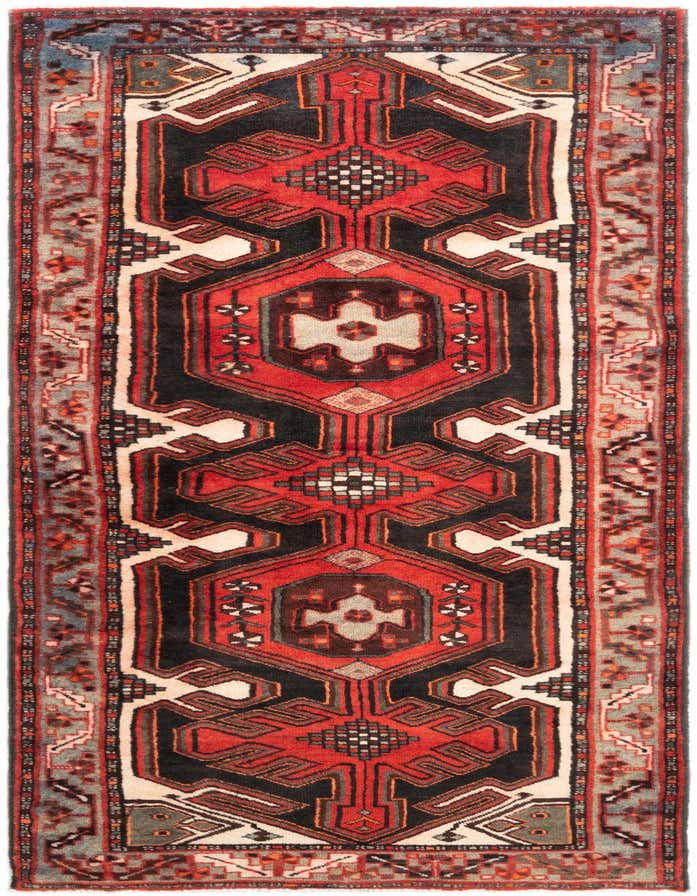 A 10 ft Hamedan runner rug featuring a tribal and traditional pattern in reds, black, and cream.