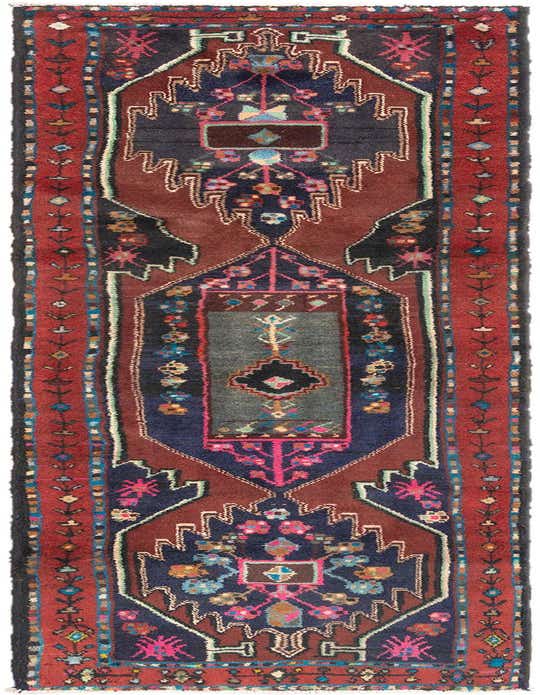 A handmade Hamedan 10 ft wool runner rug in reds and blues, featuring a traditional tribal pattern with geometric motifs.