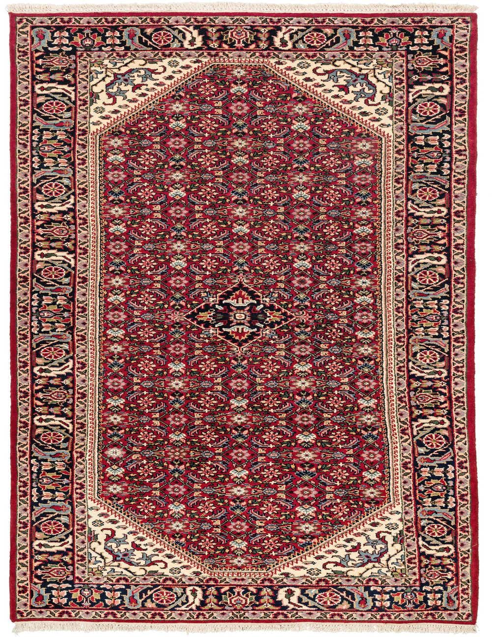 A 11 Ft runner rug in traditional Oriental style, featuring a red field with intricate floral patterns and a central medallion, framed by a dark border.