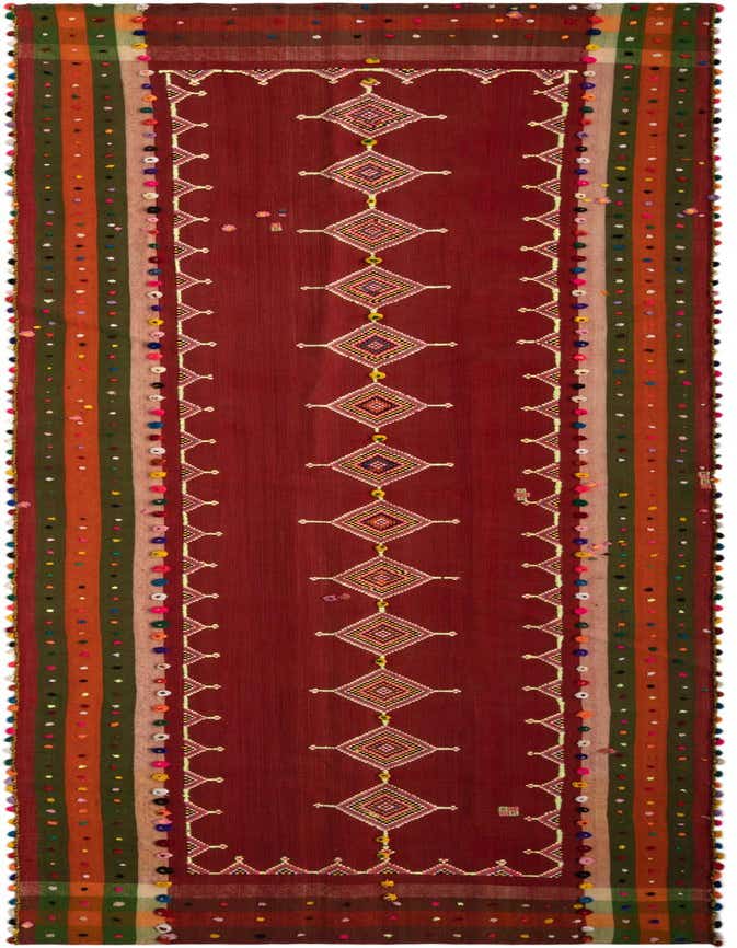 A 12 ft red Persian runner rug with a central column of colorful diamond patterns and striped borders with pom-poms, ideal for a hallway.