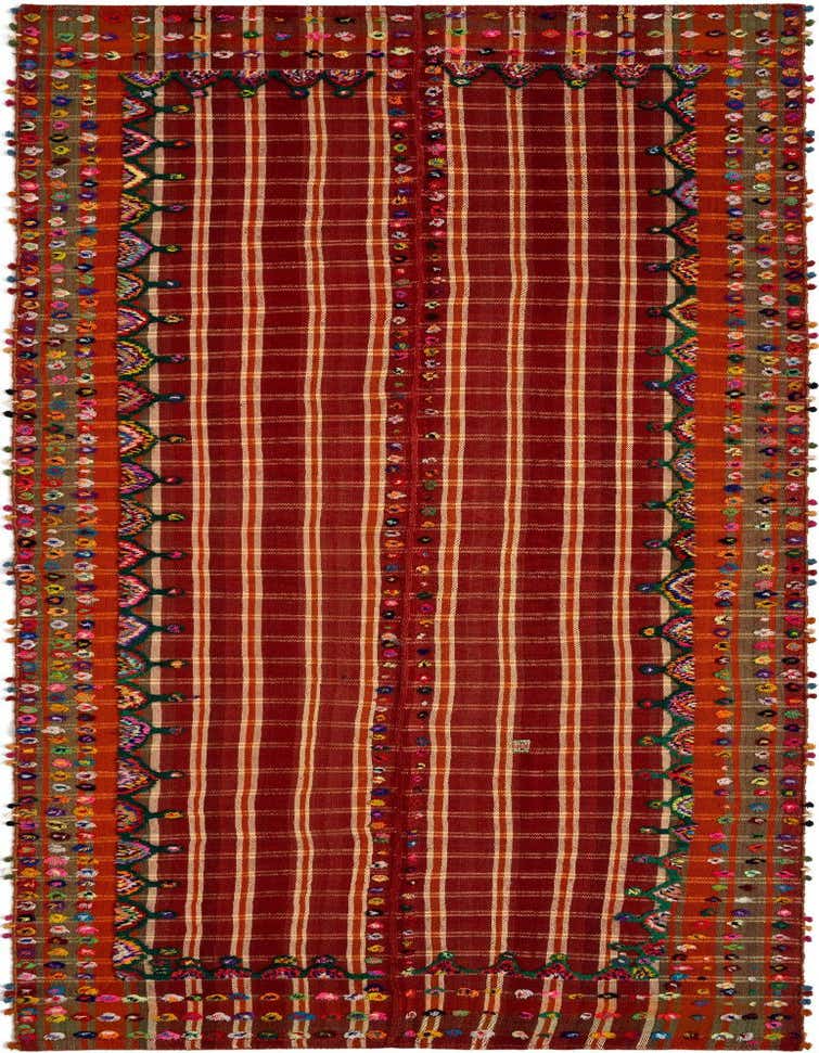 A handmade 14 ft Jajim runner rug in rich reds with a striped Persian pattern and colorful pom-pom details.