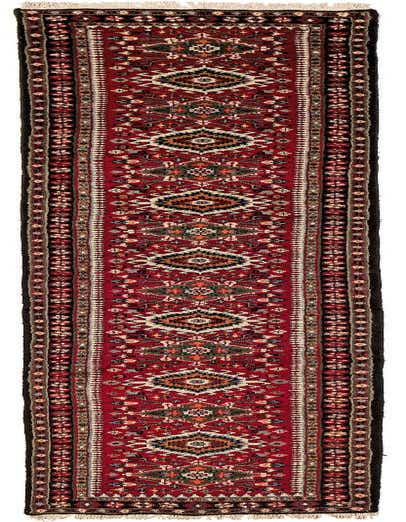 A 13 ft runner rug in traditional Karadja style, featuring a rich red field with intricate geometric and floral patterns in black, cream, and green, suitable for a hallway.