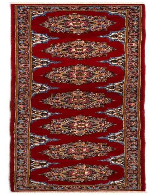 A 12 ft handmade red Persian runner rug with intricate floral medallions and a detailed border, ideal for a hallway.