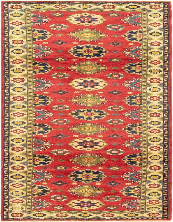 A 10 ft runner rug in a traditional tribal pattern, featuring a vibrant red field with navy, gold, and green medallions, framed by a cream border.