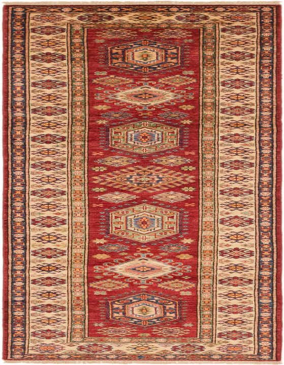 A 10 ft runner rug in traditional Southwestern style, featuring a deep red field with intricate tribal patterns and a cream border.