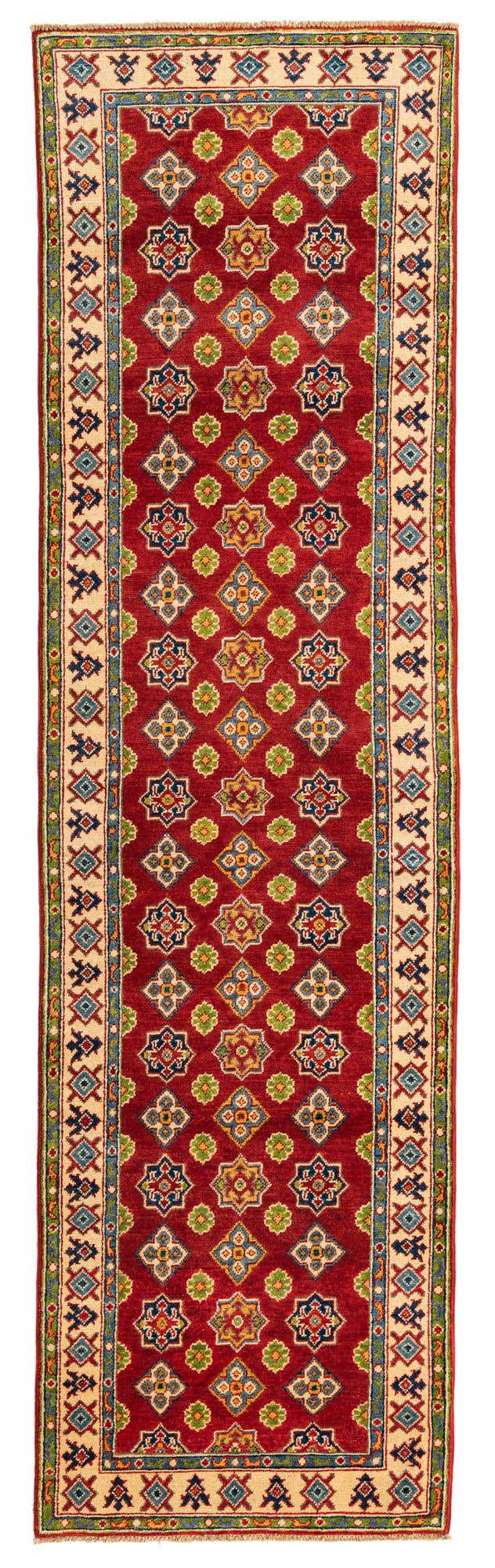 A 10 ft red runner rug with a traditional botanical pattern and intricate cream and blue borders, ideal for a hallway.