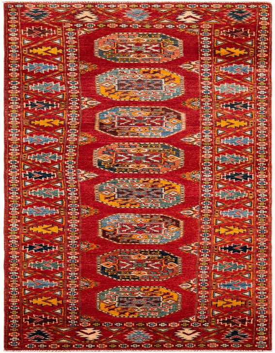 A 10 ft runner rug in rich red, featuring a modern Oriental pattern with geometric medallions in blue, yellow, and cream, ideal for a hallway.