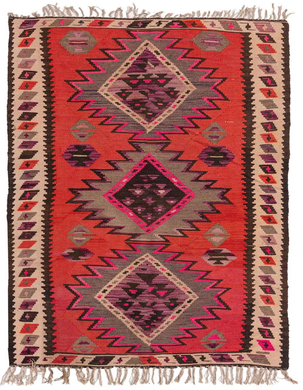 A vibrant 8 ft runner rug with a red background, featuring large geometric diamond patterns in purple, pink, gray, and black, with a tribal border and fringe.