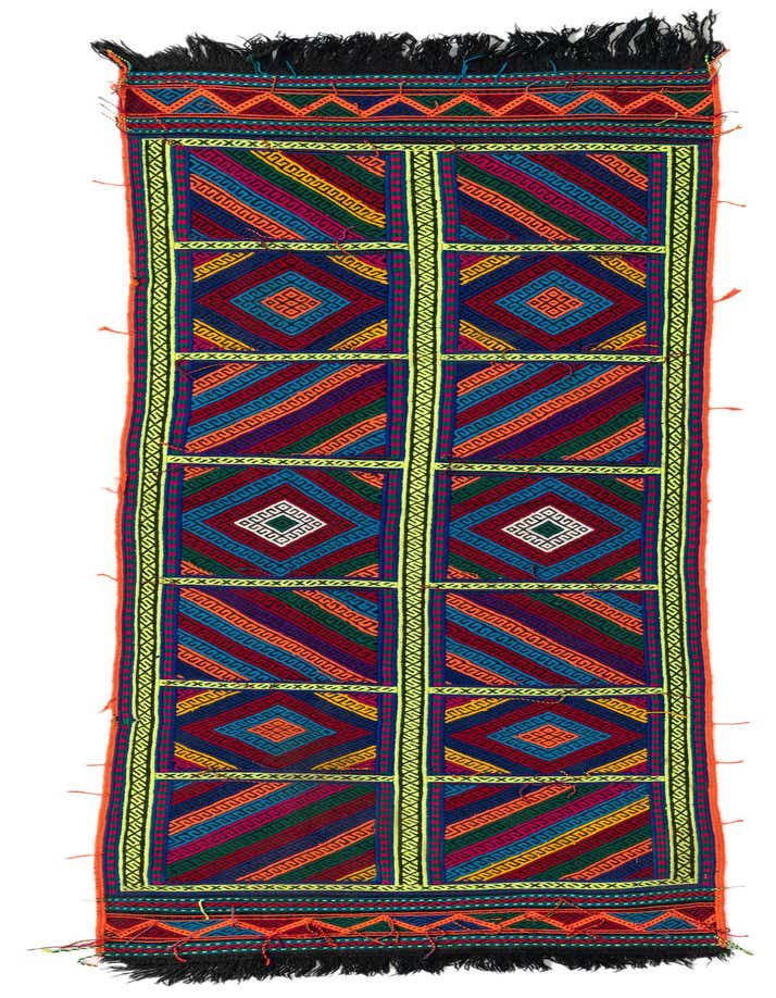 A vibrant 7 ft Kilim Fars runner rug with a tribal pattern in reds, blues, greens, and yellows, featuring geometric squares and diamond motifs.