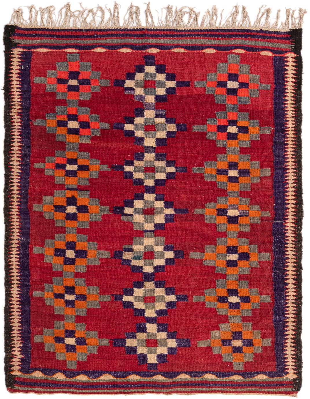 A 7 ft runner rug, the Kilim Fars features a vibrant red background with a tribal geometric pattern in orange, blue, and cream.