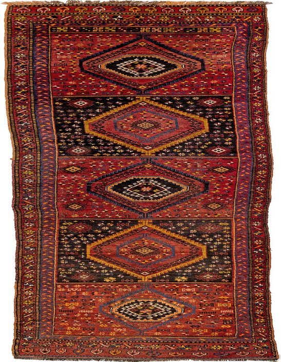 A 13 ft Kurd runner rug in rich reds, black, and gold with large geometric diamond patterns, ideal for a hallway.