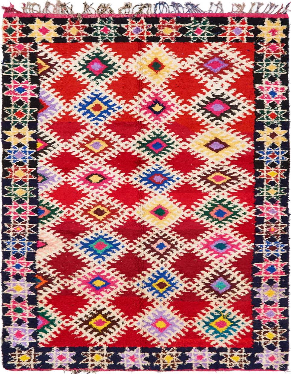 A vibrant 10 Ft Runner rug in a Moroccan tribal pattern, featuring red, white, and multicolored geometric diamonds with a dark border.