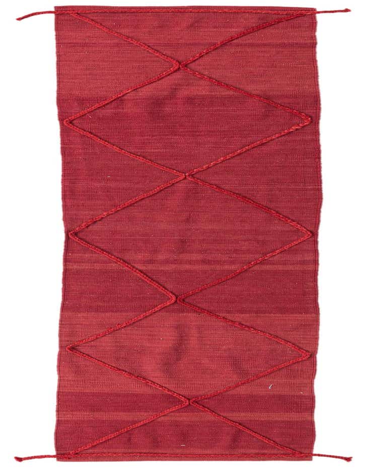 A 10 ft red wool runner rug featuring a modern tribal diamond pattern, ideal for a hallway.