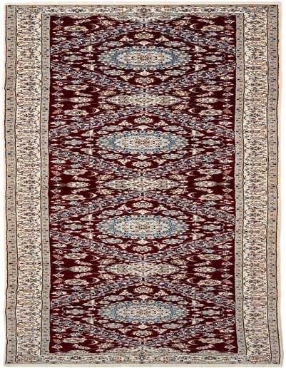 A 13 ft handmade wool runner rug in deep red with intricate traditional floral patterns and light blue and cream accents, perfect for a hallway.