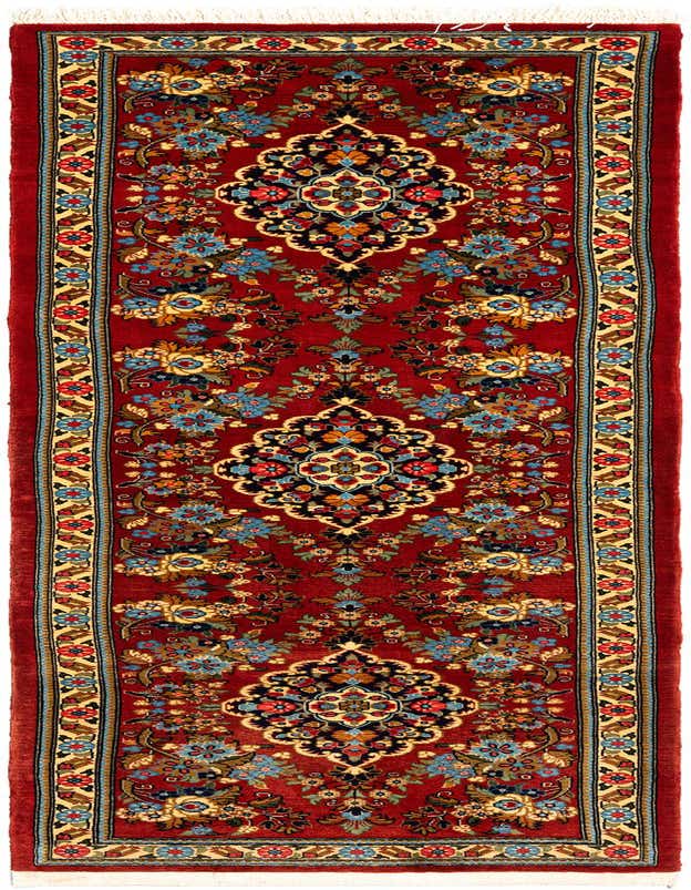 A 7 ft red Persian runner rug with intricate floral and medallion patterns in blue, gold, and black, suitable for a hallway.