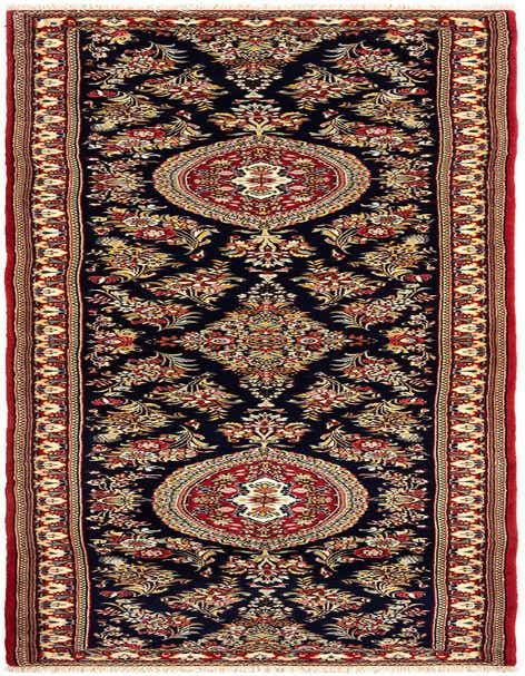 A 13 ft runner rug from the Rugs.com Qom collection, featuring a traditional Persian floral pattern in reds, creams, and blues on a dark background, with a red border.