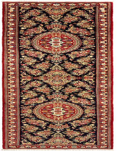 A 14 ft runner rug from the Qom collection, featuring a detailed Persian floral pattern in reds, gold, and blue on a dark background, with a red border.