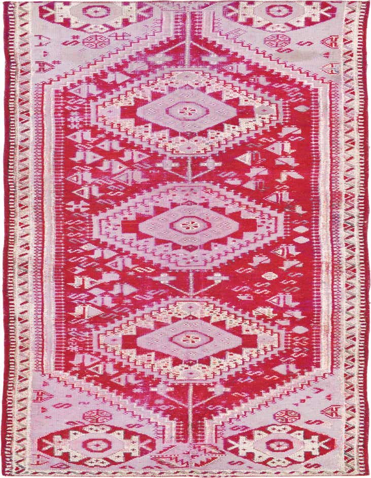 A long 11 Ft runner rug in reds with a vintage tribal botanical pattern, ideal for a hallway.