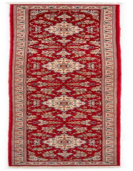 A 13 ft red Persian runner rug with intricate floral and medallion patterns in cream, blue, and green, suitable for a hallway.
