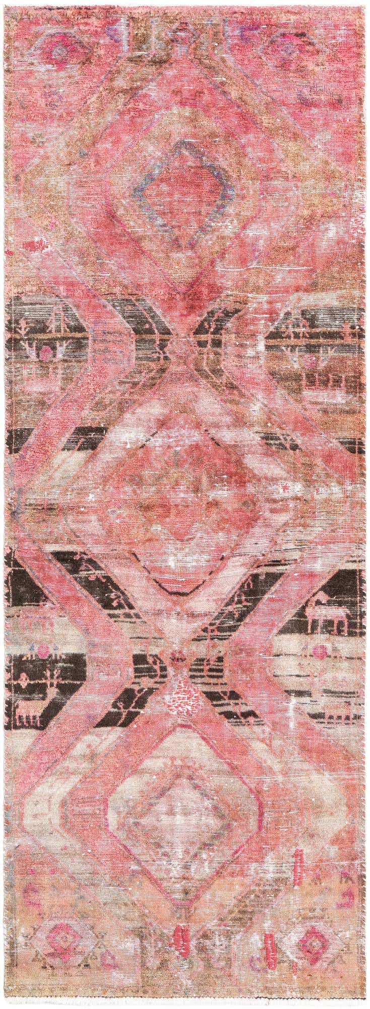 A 9 ft runner rug in shades of red, pink, and brown with a distressed Persian-inspired geometric pattern, suitable for a hallway.