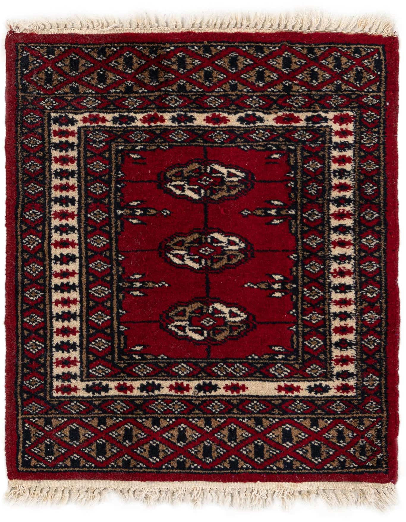 A 1' 7 x 2' 1 square traditional Bokhara rug in deep red with intricate tribal patterns and fringed edges.