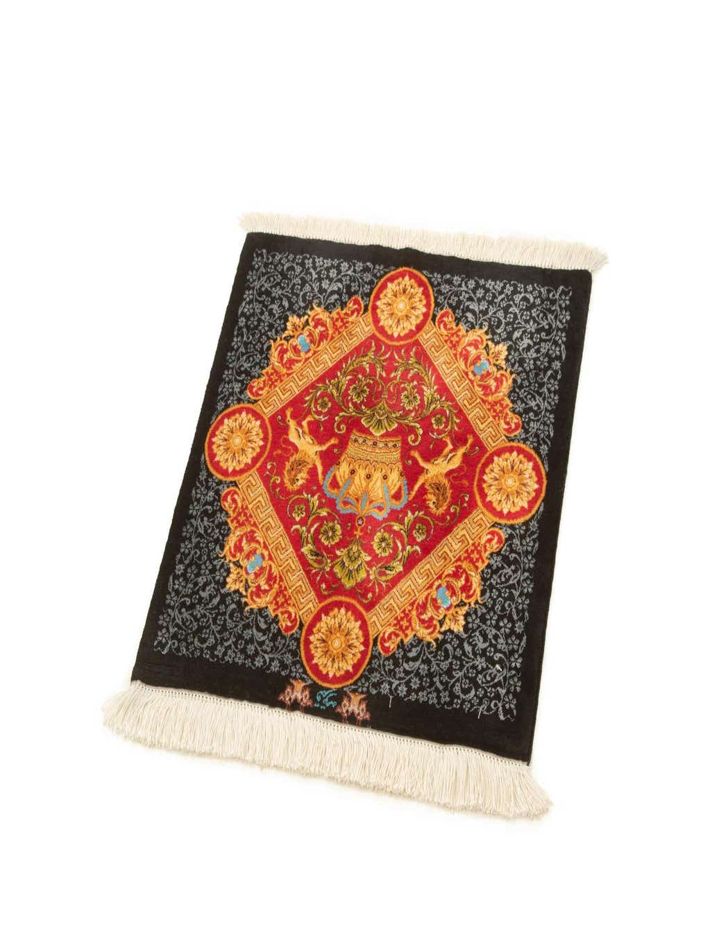 A luxurious 1' 6 x 1' 6 square red and black silk rug with an ornate central medallion and floral border.