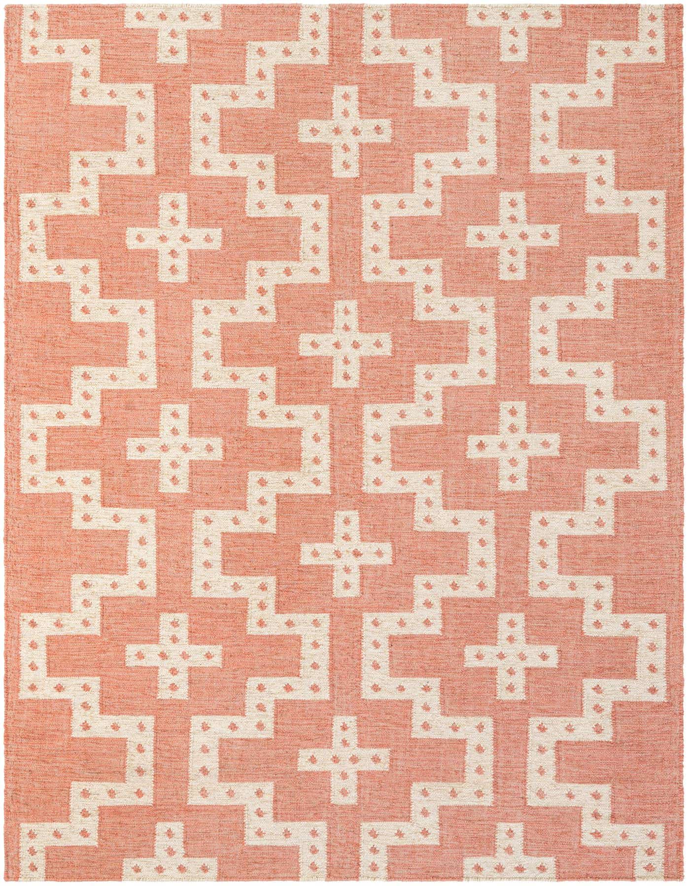 A 6x9 rectangular red and cream tribal flatweave rug with a repeating geometric pattern, suitable for a living room.