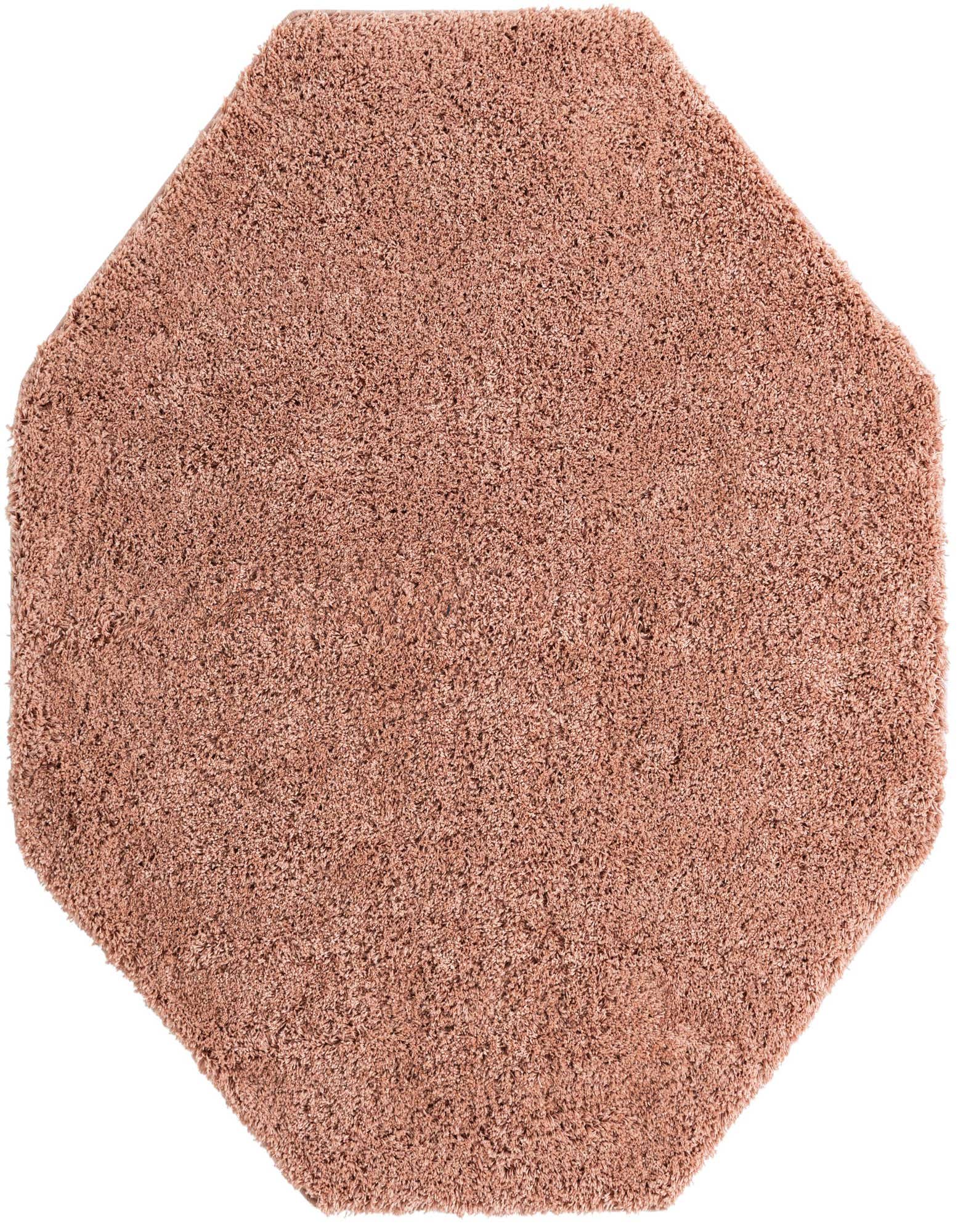 A 6' 0 x 6' 0 octagon pink shag rug with a modern, solid design, perfect for an indoor living space.