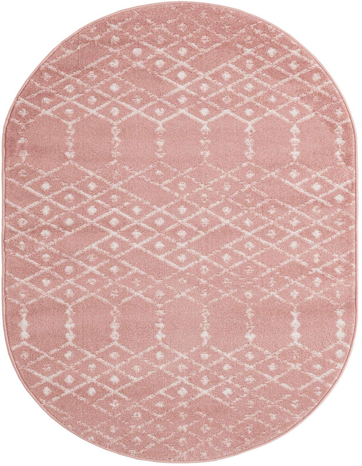 A 3' 3 x 5' 3 oval pink area rug featuring a modern tribal trellis pattern in white, suitable for indoor spaces.