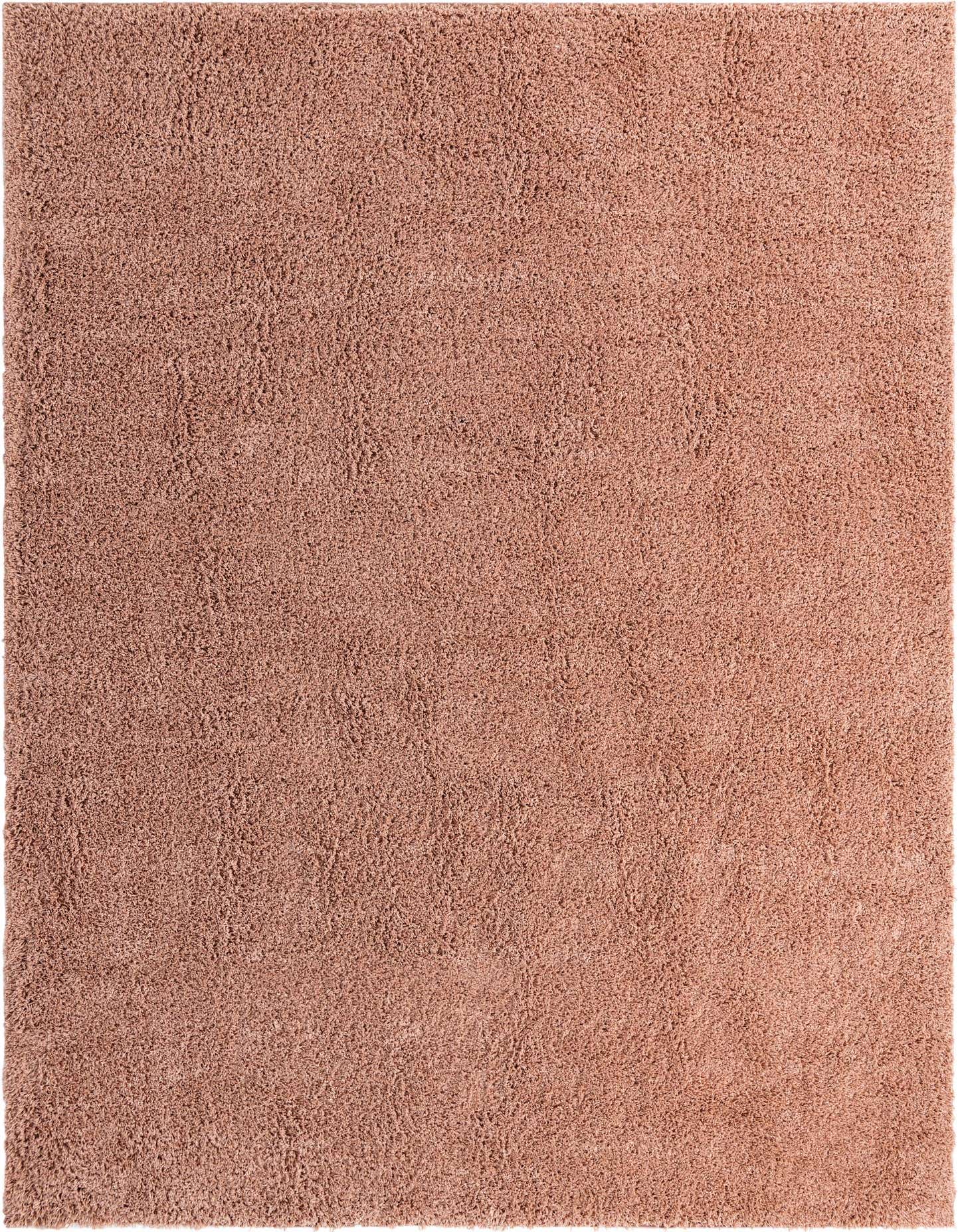 A large 10x14 rectangular pink shag rug with a textured, solid modern design, perfect for adding warmth to an indoor space.
