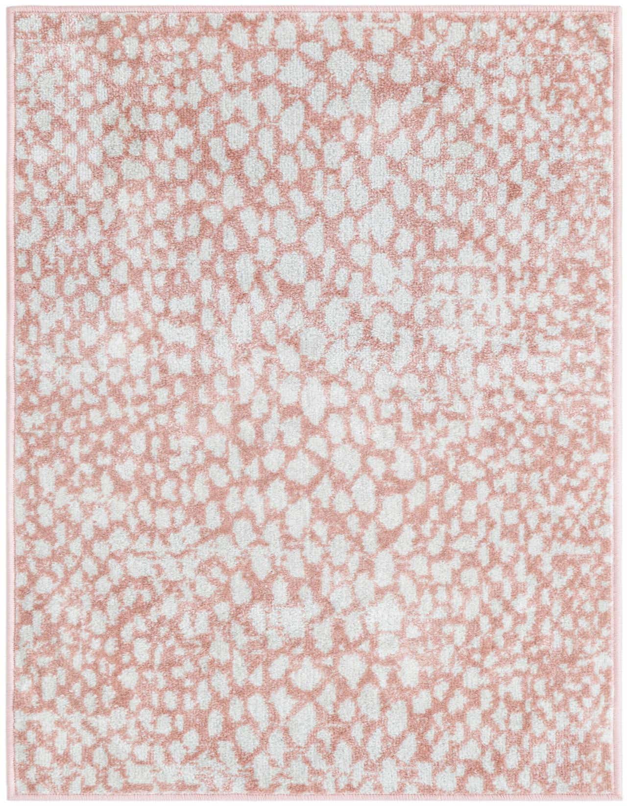 A 2x3 rectangular Kamala Washable rug featuring a modern abstract pattern in shades of pink and red on a light background, suitable for indoor spaces.