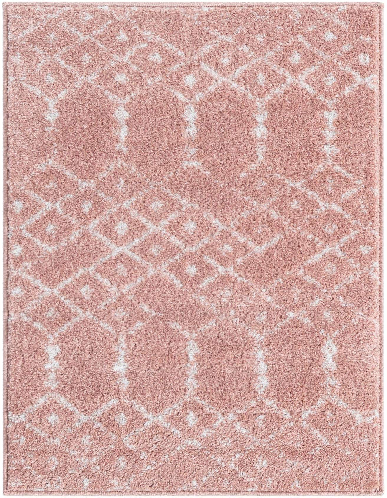 A 2x3 rectangular Paxon Trellis rug in pink and white, featuring a modern tribal trellis pattern.