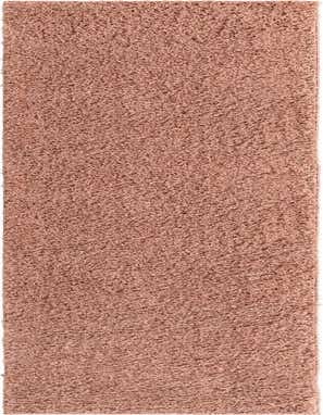 A long 16 ft runner rug from the Everyday Shag collection in a solid blush pink color, perfect for a hallway.