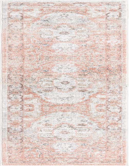 A 7 ft runner rug in the Madeline Vintage collection, featuring a distressed traditional medallion pattern in soft pinks, reds, and white, ideal for a hallway.