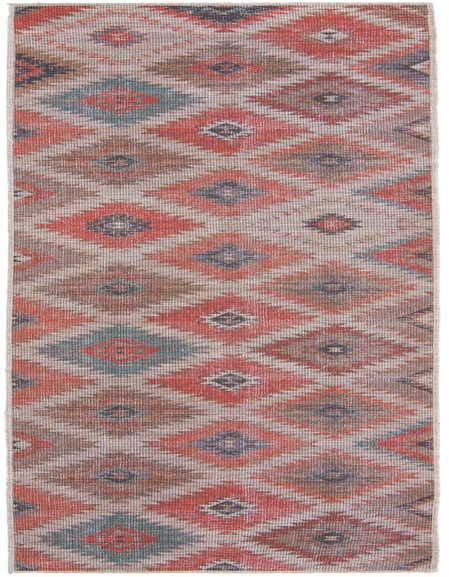 A 12 ft runner rug with a Southwestern tribal pattern in rust red, beige, brown, and teal, featuring diamond motifs.
