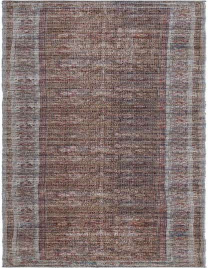 A 10 ft runner rug in rust red and brown, featuring a faded traditional floral pattern with a light border.