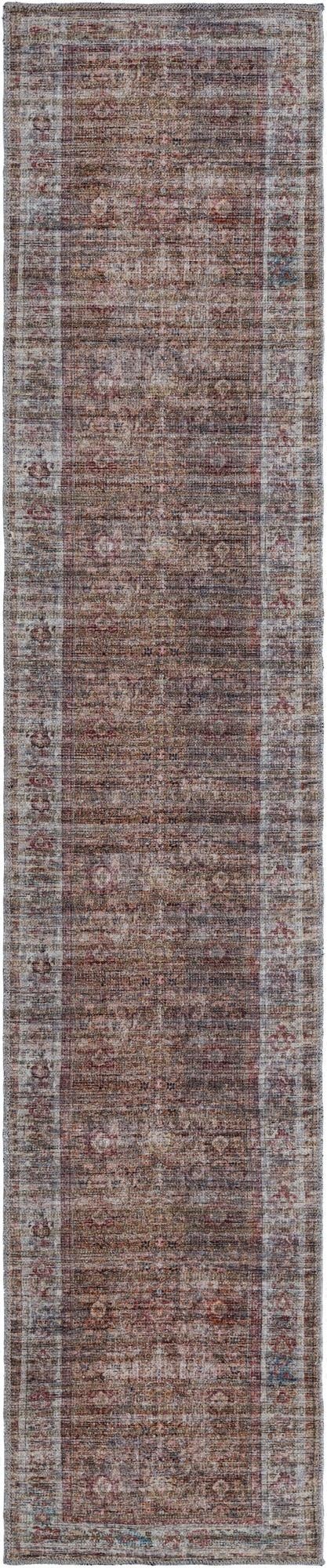 A 10 ft runner rug in rust red and brown, featuring a faded traditional floral pattern with a light border.