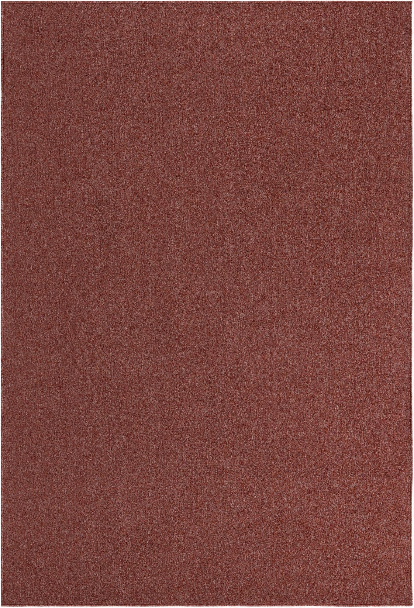 A 6x9 rectangular Everyday Solid rug in a modern, solid orange-red hue, suitable for a living room.