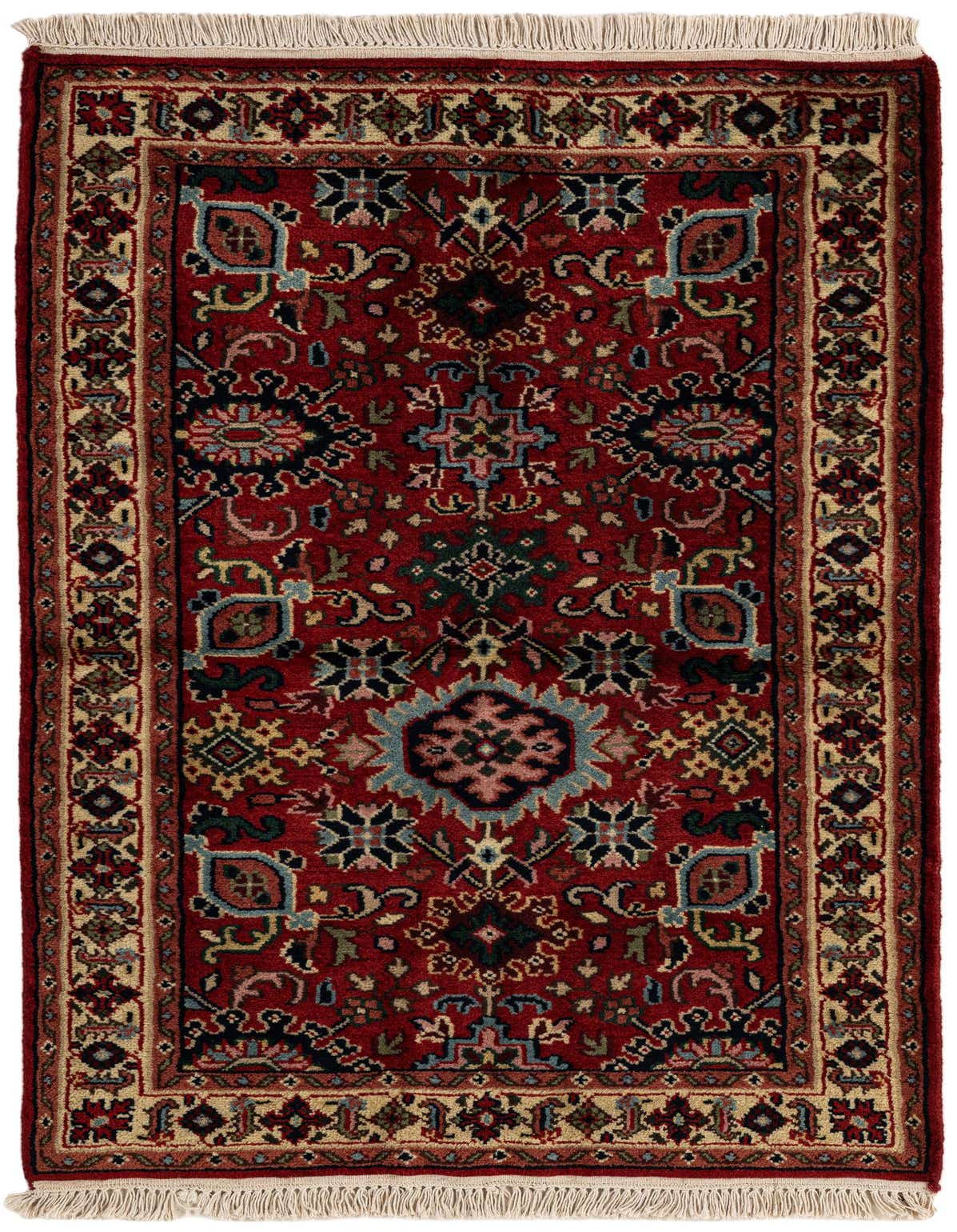 A 3x5 rectangular Heriz rug with a traditional Oriental pattern in oranges, reds, and blues, featuring a detailed border and fringe.