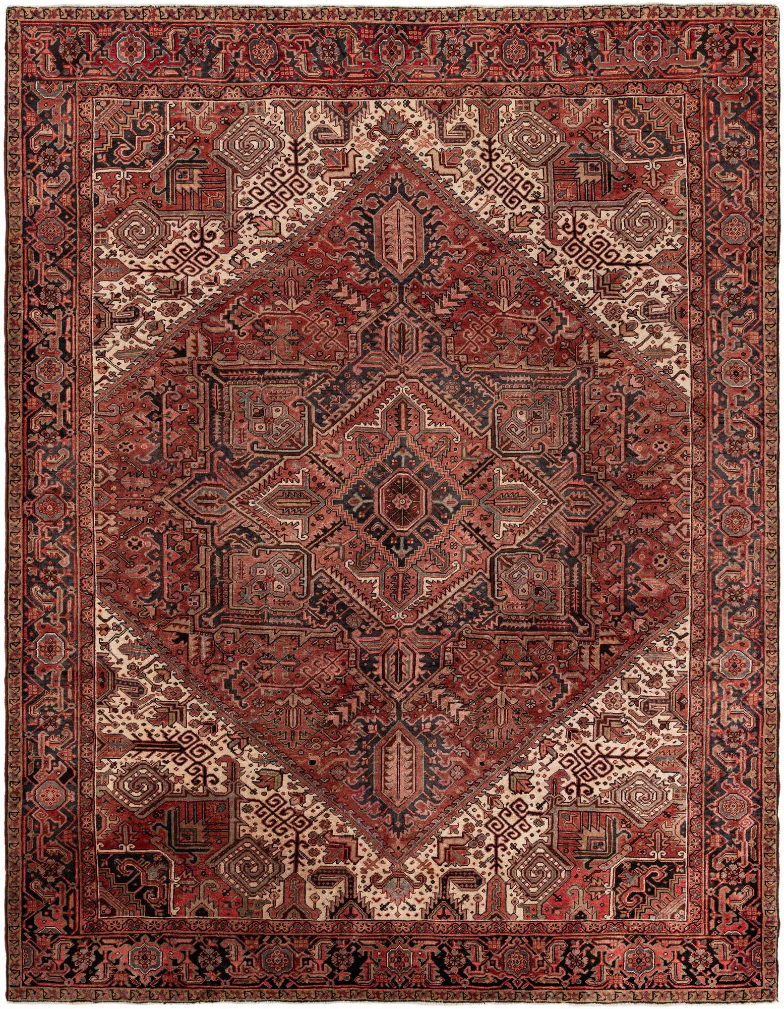 A large 10x12 rectangular Heriz rug featuring a traditional Persian medallion pattern in rich oranges, reds, and creams.