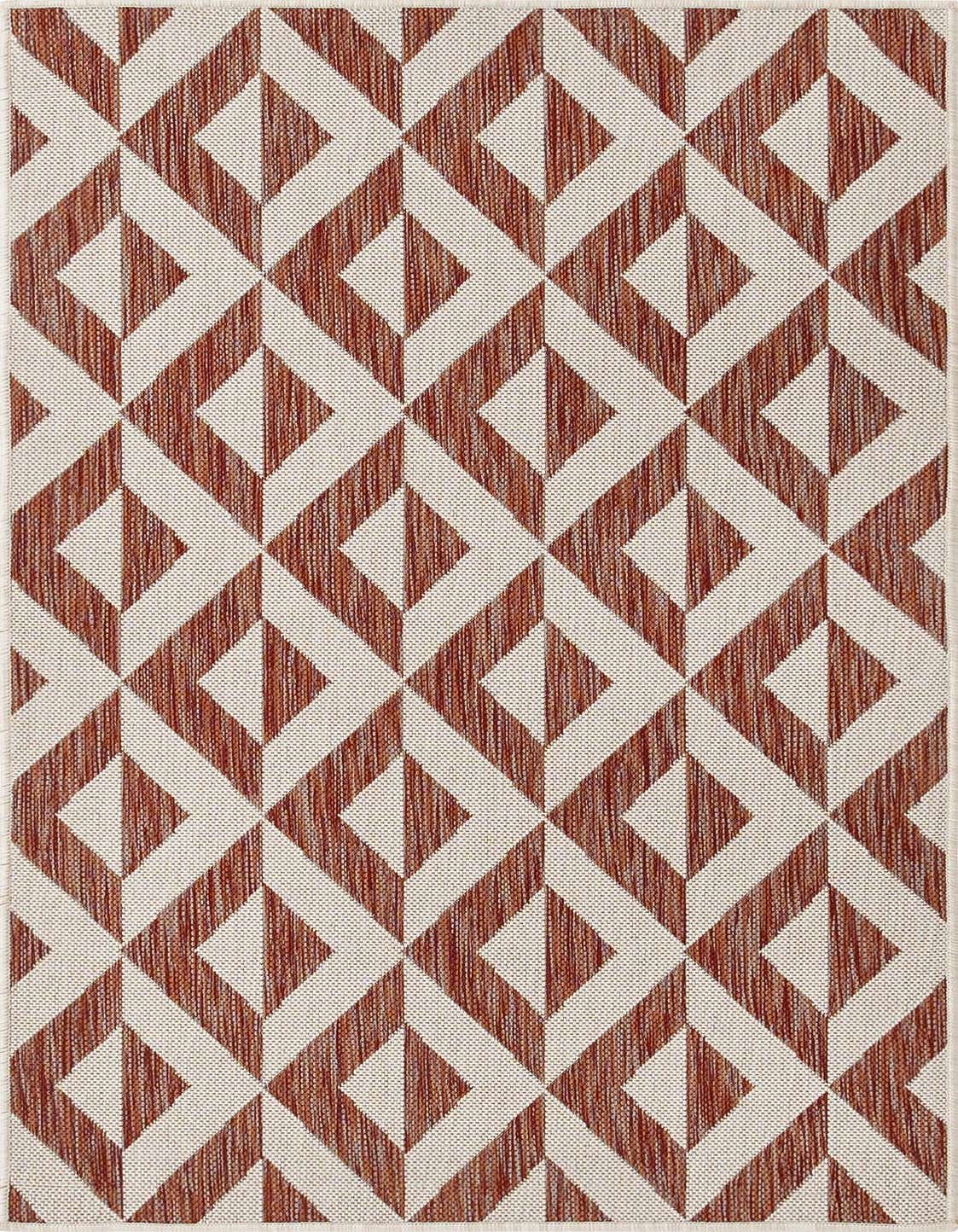 A 3x5 rectangular Jill Zarin Outdoor rug with a modern trellis pattern in shades of orange and red, suitable for a patio.